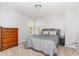 Inviting bedroom features a comfortable bed, dresser, and a light gray color scheme at 1109 Forest Willow Ln, Morrisville, NC 27560
