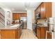 Well-equipped kitchen boasts stainless steel appliances, ample counter space, and a functional island at 1109 Forest Willow Ln, Morrisville, NC 27560