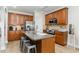 Eat-in kitchen with hardwood floors, stainless steel appliances, and large center island with barstool seating at 1109 Forest Willow Ln, Morrisville, NC 27560