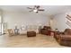 Spacious living room with hardwood floors, comfortable seating, and a ceiling fan at 1109 Forest Willow Ln, Morrisville, NC 27560