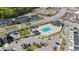 Aerial view of community pool, clubhouse, playground, and parking at 1126 Russet Ln, Apex, NC 27523