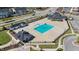An aerial view of community pool and clubhouse with large parking lot at 1126 Russet Ln, Apex, NC 27523