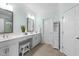 Bright bathroom with double sink vanity, framed mirrors, and ample counter space at 1126 Russet Ln, Apex, NC 27523