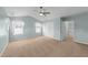Relaxing bedroom showcasing dual windows, a ceiling fan, and ample closet space at 1126 Russet Ln, Apex, NC 27523