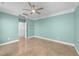 This spacious bedroom features sleek epoxy floors and modern ceiling fan at 1126 Russet Ln, Apex, NC 27523