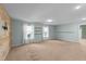Versatile bonus room with natural light and wood-paneled wall adding charm at 1126 Russet Ln, Apex, NC 27523