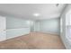 Spacious bonus room with plush carpet and large windows offering abundant natural light at 1126 Russet Ln, Apex, NC 27523