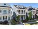Charming two story home with double balconies and a well manicured lawn at 1126 Russet Ln, Apex, NC 27523