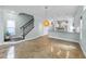 Open-concept living room next to the kitchen with a staircase and contemporary decor at 1126 Russet Ln, Apex, NC 27523