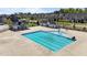 Aerial shot of a community pool with lap lanes, a splash area, and nearby recreation buildings at 1126 Russet Ln, Apex, NC 27523