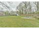 This backyard features a well-maintained lawn, perfect for outdoor enjoyment and relaxation at 116 Crawford Rd, Hillsborough, NC 27278