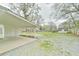 Expansive backyard featuring a covered patio, detached garage, and ample green space, perfect for outdoor enjoyment and activities at 116 Crawford Rd, Hillsborough, NC 27278