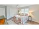 Bright bedroom features double closet, window, side tables, and stylish bedding at 116 Crawford Rd, Hillsborough, NC 27278