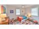 Charming bedroom features a colorful rug, natural light, and playful decor at 116 Crawford Rd, Hillsborough, NC 27278