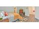 Cozy bedroom features hardwood floors, neutral walls, ceiling fan, and natural light at 116 Crawford Rd, Hillsborough, NC 27278