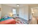 Bright bedroom with closet, ceiling fan, decor, and a view into an adjacent room at 116 Crawford Rd, Hillsborough, NC 27278