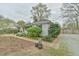 Charming exterior featuring brick accents, lush landscaping, and a well-maintained yard for beautiful curb appeal at 116 Crawford Rd, Hillsborough, NC 27278