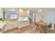 Modern eat-in kitchen featuring white cabinets, stainless steel appliances, and decorative lighting at 116 Crawford Rd, Hillsborough, NC 27278