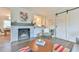 Stylish living room area with fireplace and kitchen access, perfect for modern living and entertaining at 116 Crawford Rd, Hillsborough, NC 27278