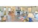 Open concept living area featuring a fireplace, kitchen, dining area, barn door and modern decor at 116 Crawford Rd, Hillsborough, NC 27278