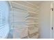 Walk-in closet offers ample storage with adjustable wire shelving system at 116 Crawford Rd, Hillsborough, NC 27278