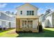Beautiful backyard with a covered patio, sliding glass doors, and lush green lawn at 1207 Chaney Rd, Raleigh, NC 27606