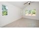 Bright bedroom features a vaulted ceiling and ample natural light at 1207 Chaney Rd, Raleigh, NC 27606