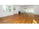 Living room with hardwood floors, fireplace and sliding glass doors leading to the backyard at 1207 Chaney Rd, Raleigh, NC 27606