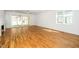 Spacious living room with hardwood floors, fireplace and sliding glass doors leading to the backyard at 1207 Chaney Rd, Raleigh, NC 27606