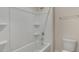A full bathtub and shower combination with a towel rack at 125 Pisgah St, Sanford, NC 27330