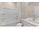 Bathroom featuring a tub/shower combo and single sink vanity at 125 Pisgah St, Sanford, NC 27330