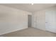 An empty bedroom with carpet and a neutral color palette at 125 Pisgah St, Sanford, NC 27330