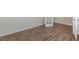 Clean aesthetic, featuring a neutral color palette, wood-look floors, and double french doors at 125 Pisgah St, Sanford, NC 27330