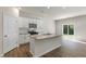 Modern kitchen boasting granite countertops, stainless appliances, and a sliding glass door at 125 Pisgah St, Sanford, NC 27330