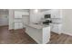 Open kitchen design with granite countertops, a center island, and stainless steel appliances at 125 Pisgah St, Sanford, NC 27330