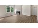 The living room is bright with natural light, wood floors, and modern fireplace at 125 Pisgah St, Sanford, NC 27330