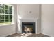 Bright living room highlighting a modern fireplace and large window at 125 Pisgah St, Sanford, NC 27330