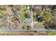 This aerial view shows the layout of the property surrounded by trees at 13832 Nc 96 N Hwy, Zebulon, NC 27597