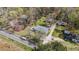 Overhead view of property, road, and surrounding wooded areas at 13832 Nc 96 N Hwy, Zebulon, NC 27597