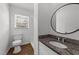 Cozy bathroom featuring granite countertops, a modern sink, a toilet, and a walk-in shower at 13832 Nc 96 N Hwy, Zebulon, NC 27597