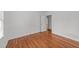 Bedroom featuring hardwood floors, a doorway, and bright light at 13832 Nc 96 N Hwy, Zebulon, NC 27597