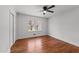 Well lit bedroom featuring a ceiling fan, hardwood floors, and a window at 13832 Nc 96 N Hwy, Zebulon, NC 27597