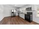Well-lit kitchen boasting stainless appliances, white cabinetry, and a functional layout at 13832 Nc 96 N Hwy, Zebulon, NC 27597