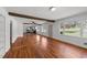 Inviting living space with hardwood floors, white walls, and a clear view of the adjacent kitchen at 13832 Nc 96 N Hwy, Zebulon, NC 27597