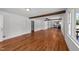 Bright living room featuring beautiful hardwood floors and a stylish beam accent at 13832 Nc 96 N Hwy, Zebulon, NC 27597