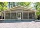 Charming home featuring a screened-in porch and gravel landscaping for low maintenance at 142 Blackhawk Dr, Louisburg, NC 27549