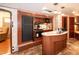This RV features a compact kitchen with modern appliances and wooden cabinets, with a breakfast bar at 142 Blackhawk Dr, Louisburg, NC 27549