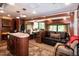 This carpeted RV features an open layout with built-in bunk beds, a kitchen, booth dining, and sofa at 142 Blackhawk Dr, Louisburg, NC 27549