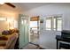 Bright living room with doorway to a covered deck with picnic table at 142 Blackhawk Dr, Louisburg, NC 27549