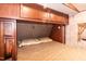 Comfortable main bedroom featuring overhead storage and a soft, inviting bed at 142 Blackhawk Dr, Louisburg, NC 27549